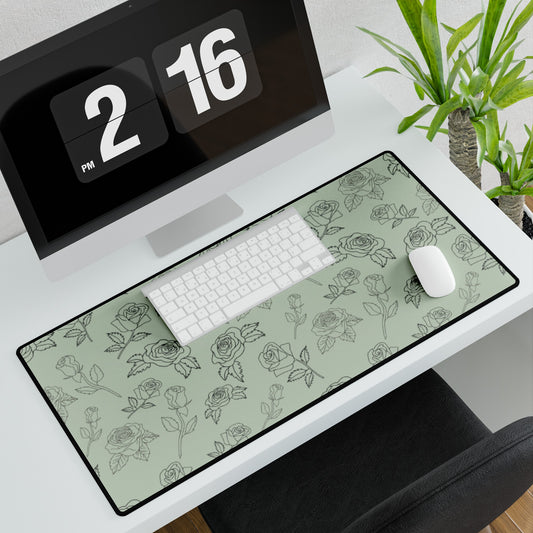 Rose Outline on a Sage Green Background Desk Mat